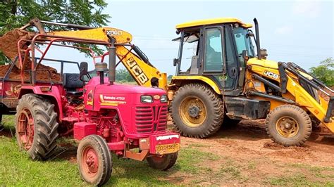 New Jcb 3dx Backhoe Machine Loading Red Mud In 2 Mahindra Tractors