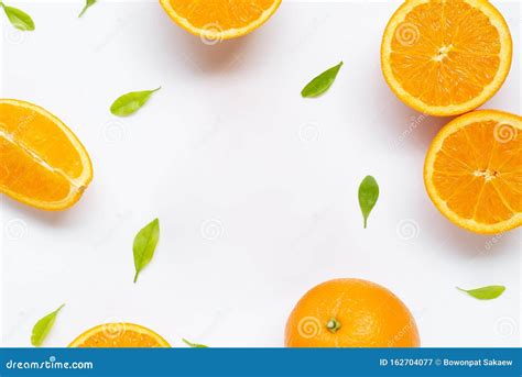 Frame Made Of Fresh Orange Citrus Fruit With Leaves Isolated On White