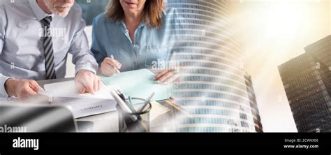 Two Mature Business People Working Together In Office Multiple Exposure Stock Photo Alamy
