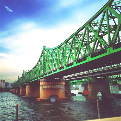 Premium Photo Bridge Over River Against Sky