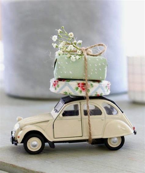 A Toy Car With Presents On Top Of It