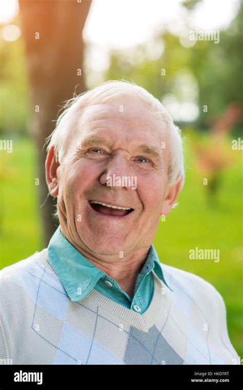 Old man laughing Stock Photo - Alamy