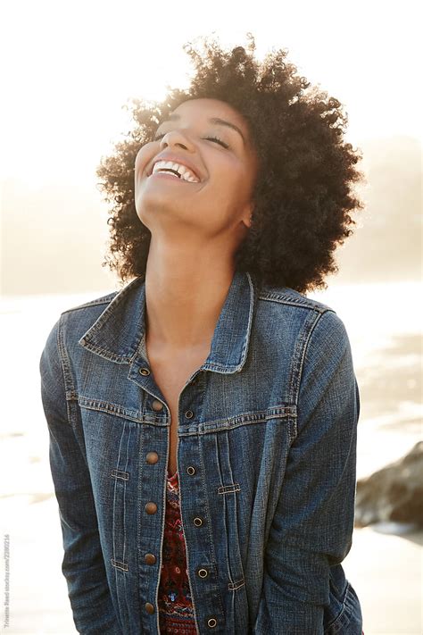 «portrait Of Mixed Race Woman Smiling On The Beach Del Colaborador De