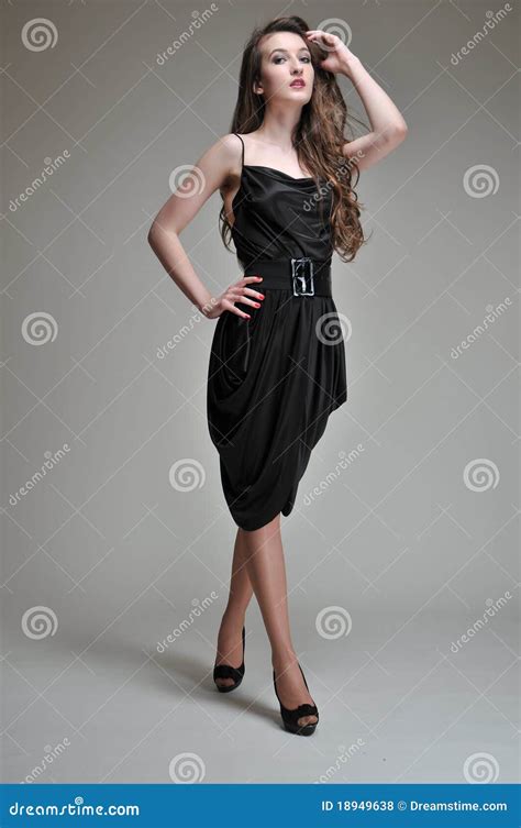 Woman Posing In Black Dress Stock Photo Image Of Background Brown