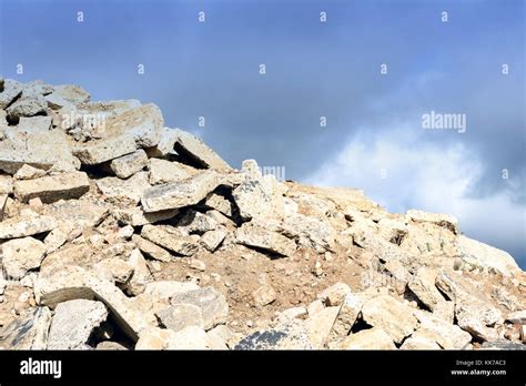 Broken Pile Of Hardcore Cement Rubble Stacked In A Loose Pile With A