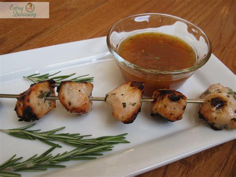 Eating Deliciously Grilled Rosemary Chicken Kabobs With Apricot Sauce