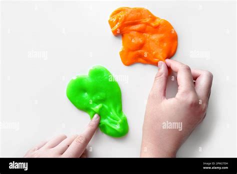 Playing With Textured Slime With Bubbles Stretching The Gooey Substance Female Teen Hand