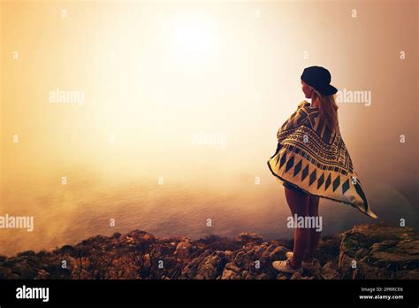 Shes Got A Wanderers Spirit A Happy Young Woman Admiring A Foggy View