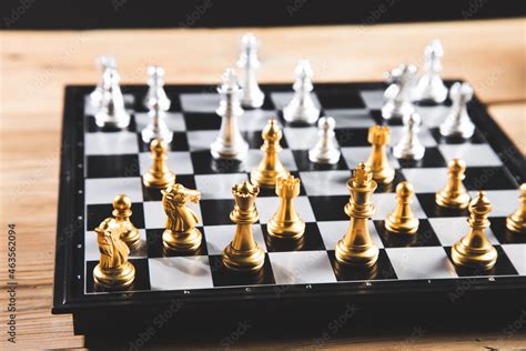 gold and silver chess pieces Stock Photo | Adobe Stock