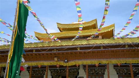 Colorful Buddhist Prayer Flags Against A Blue Sky Stock Footage Video