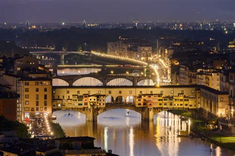 Ponte Vecchio Bridge Over Arno River At Sunset Florence Italy Stock