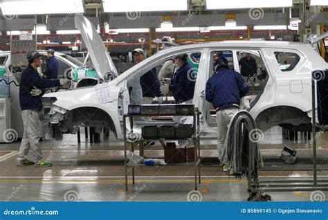 Workers Assemble A Car On Assembly Line In Car Factory Editorial Image