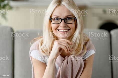 Close Up Portrait Of Middle Aged Caucasian Blonde Woman Wearing