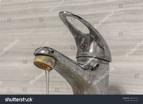 thin stream hard water flows  stock photo  shutterstock