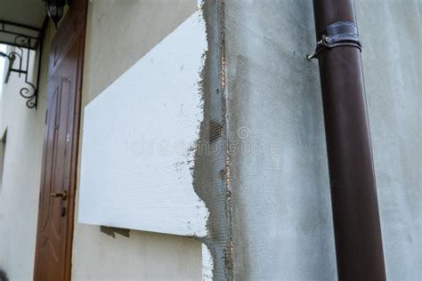 Installation of Styrofoam Insulation Sheets on House Facade Wall for ...