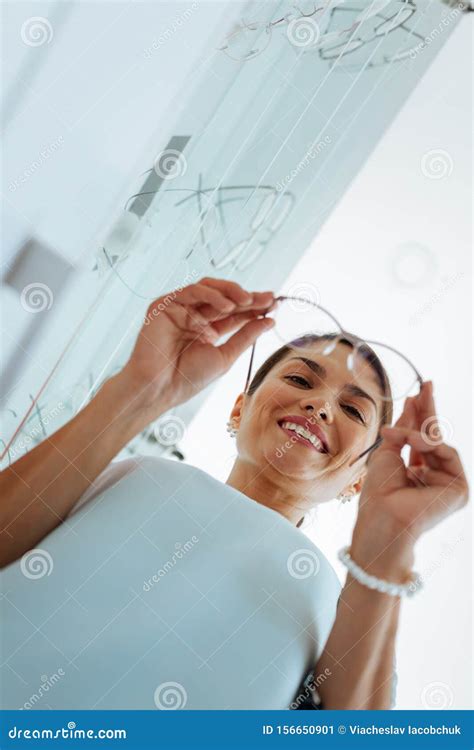 Low Angle Of A Nice Woman Looking At The Glasses Stock Image Image Of Indoors Ophthalmology