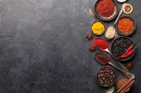 Premium Photo Various Spices In Bowls And Spoons