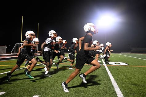 Belleville football opens season with Midnight Madness practice