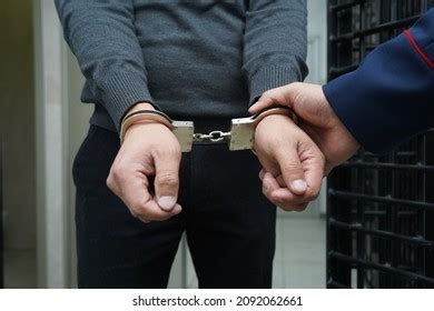 Police Officer Handcuffs Suspect Stock Photo 2097366892 | Shutterstock