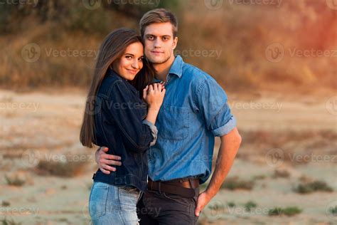 Lifestyle Portrait Of Young Attractive Couple In Love Posing Outdoor In