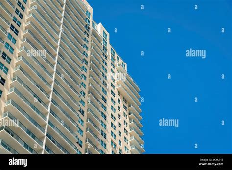 Modern Multi Storey Condominium With Glass Railings At The Balconies In