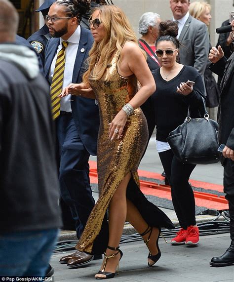 Mariah Carey Showcases Her Curves In A Slinky Metallic Dress While In New York Daily Mail Online