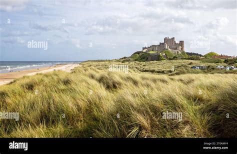 Coastal View From The West Of Bamburgh Castle Rising From The Sand