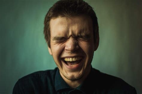 Premium Photo Close Up Of Happy Young Man With Eyes Closed Laughing