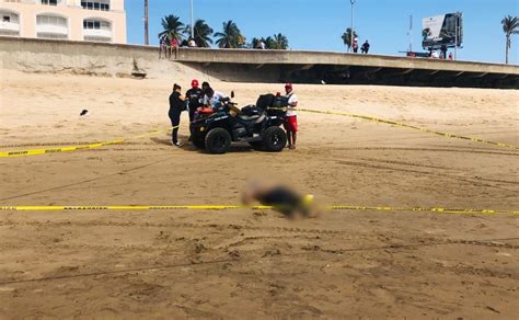 Hallan Cuerpo De Un Hombre Flotando En La Playa