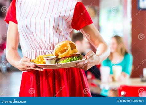 People In American Diner Or Restaurant Eating Fast Food Stock Photo - Image of diner, eatery ...