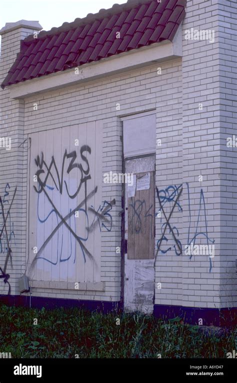 Latino gang graffiti on vacant building Stock Photo - Alamy