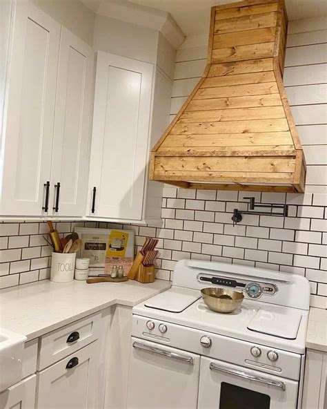 Wood Vent Hood Over A White Subway Tile Backsplash Soul And Lane