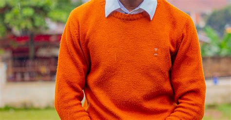 A Man In Orange Sweater · Free Stock Photo