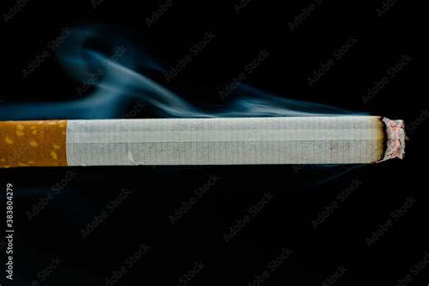 Lit cigarette Stock Photo | Adobe Stock