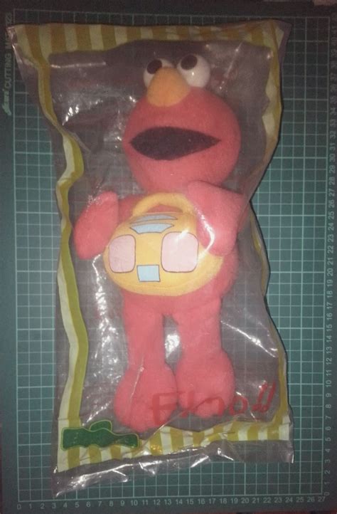 Elmo plush doll, Hobbies & Toys, Toys & Games on Carousell