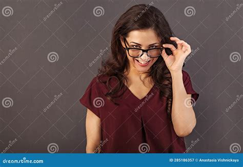 Beautiful Thinking Toothy Smiling Brunette Business Woman Looking Happy In Eye Glasses With