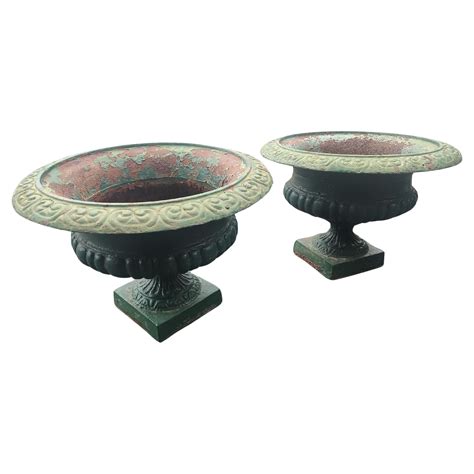 pair  late  century cast iron planters   green paint