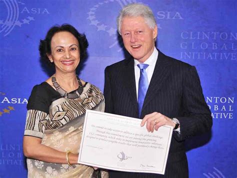 Clinton Global Initiative Award at the hands of President Bill Clinton