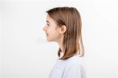 Brunette Girl Smiling With Braces On Her Teeth On A White Background Isolated Stock Photo
