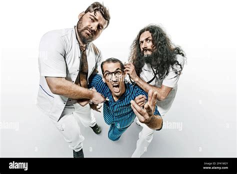 Conceptual Portrait Of Funny Doctors And Patient In The Madhouse Stock