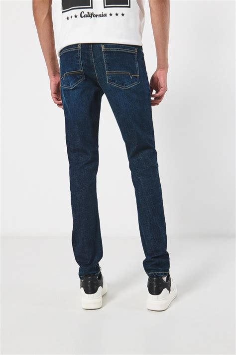 Jean skinny azul oscuro ceñido con tiro bajo y bolsillos