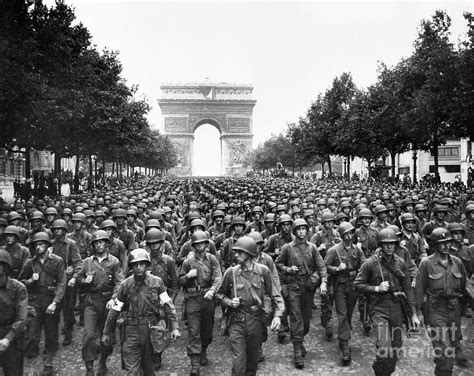 troops marching  champs elysees  bettmann