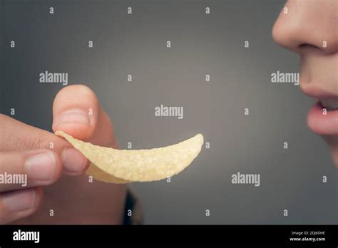 The Person Eating The Classic Potato Chips Stock Photo Alamy