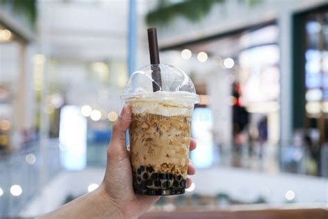 Hand Holding Iced Boba/Bubble Milk Tea Stock Photo - Image of glass ...