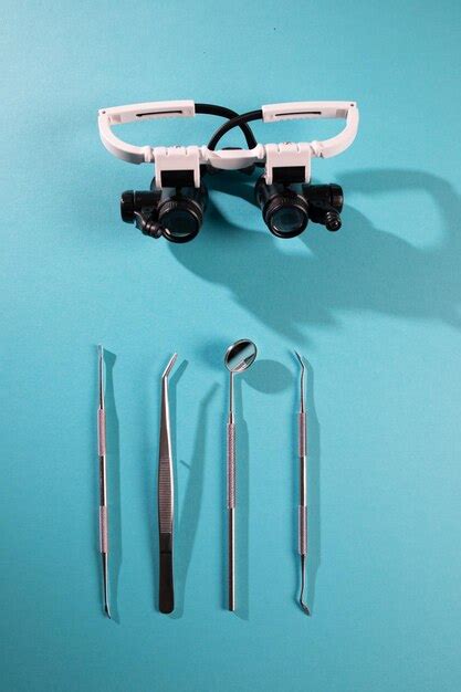 Premium Photo | Dentist tools on blue background