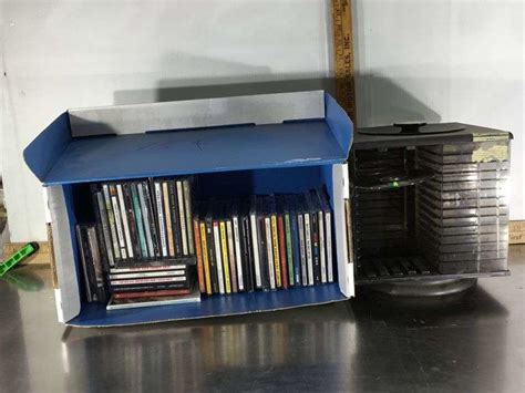 Assorted Cds And Storage Container Sherwood Auctions