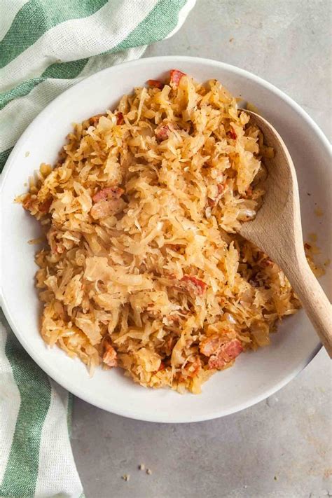 A White Bowl Filled With Food On Top Of A Table