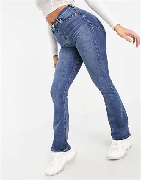 Asos Design High Rise Lift And Contour Flare Jeans In Midwash Asos