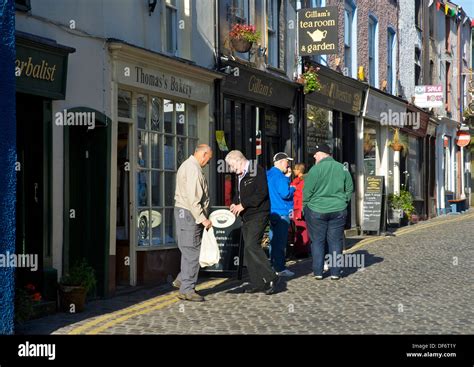 Shoppers On Market Street Ulverston Cumbria England Uk Stock Photo