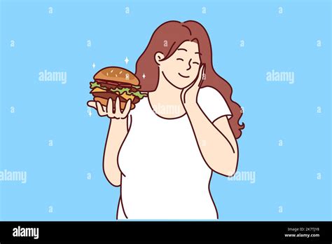 Happy Overweight Woman Holding Burger Excited About Fast Food Smiling